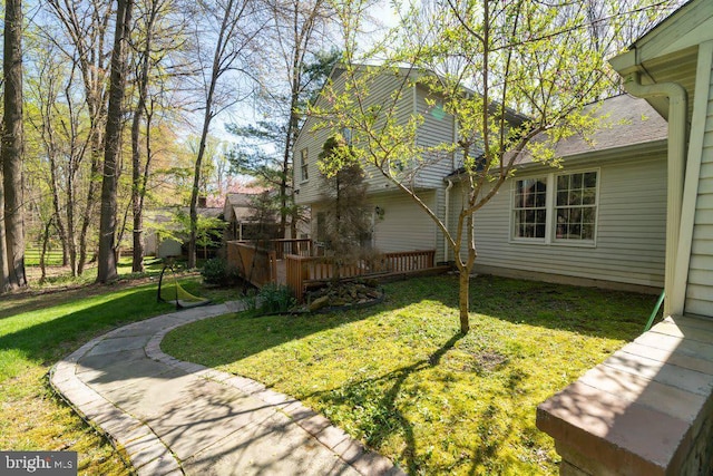 view of yard featuring a wooden deck