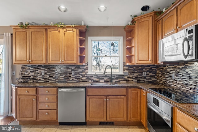 kitchen with visible vents, appliances with stainless steel finishes, open shelves, and a sink