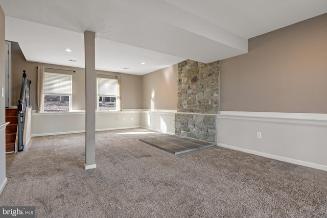 basement featuring a fireplace, recessed lighting, carpet, and baseboards