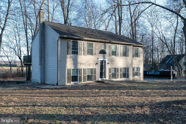 split foyer home featuring a chimney