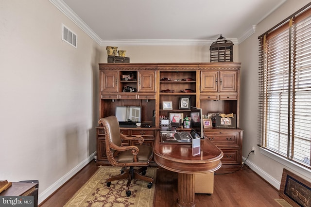 office space featuring ornamental molding, visible vents, baseboards, and wood finished floors