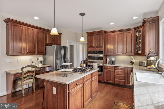 kitchen featuring dark wood-style flooring, appliances with stainless steel finishes, glass insert cabinets, a sink, and a kitchen island