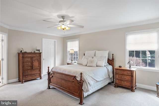 bedroom featuring light carpet, baseboards, ornamental molding, and a ceiling fan