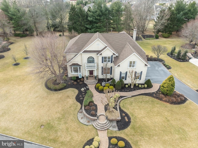 view of front of property with driveway and stucco siding