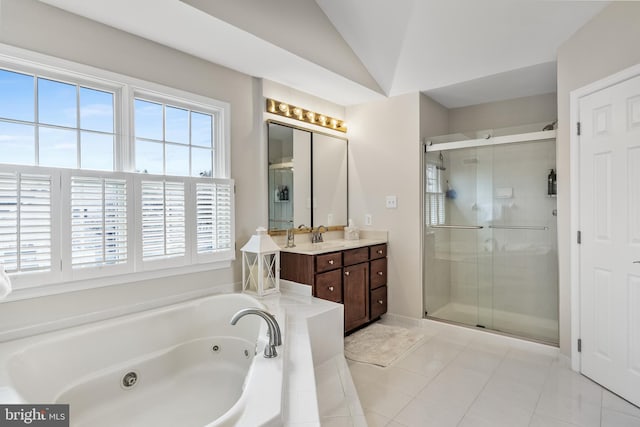 bathroom with a stall shower, lofted ceiling, tile patterned floors, a whirlpool tub, and vanity