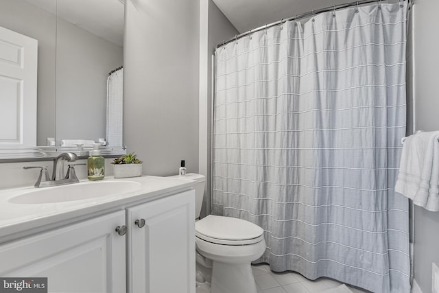 full bath with curtained shower, tile patterned flooring, vanity, and toilet