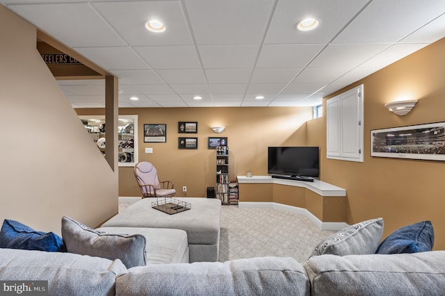 carpeted living area with recessed lighting and baseboards