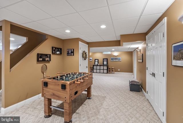 recreation room with recessed lighting, carpet, a drop ceiling, and baseboards