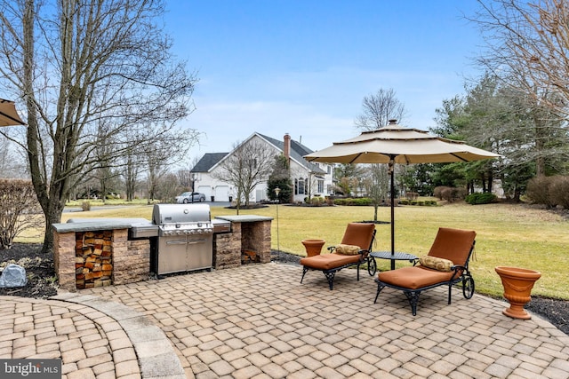 view of patio / terrace with exterior kitchen and grilling area