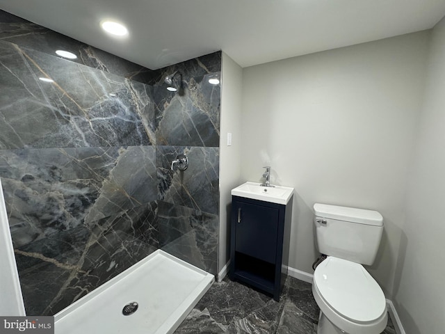 full bath featuring marble finish floor, a shower stall, and toilet