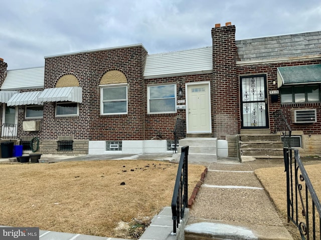 view of property featuring brick siding