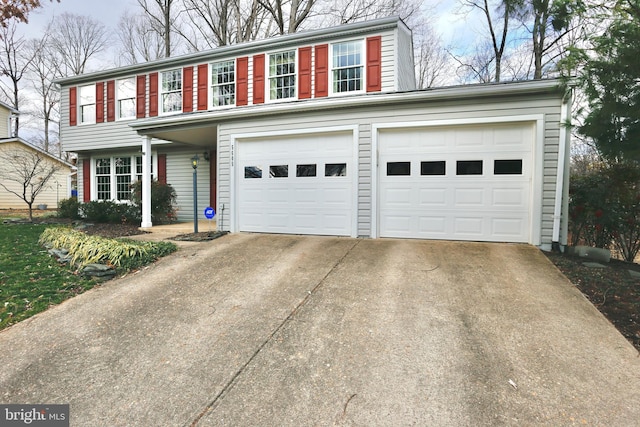 view of front of home featuring concrete driveway