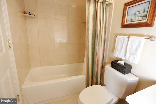 full bath with toilet and shower / bath combo with shower curtain