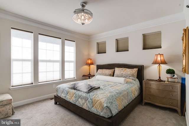 bedroom featuring ornamental molding, carpet, and baseboards