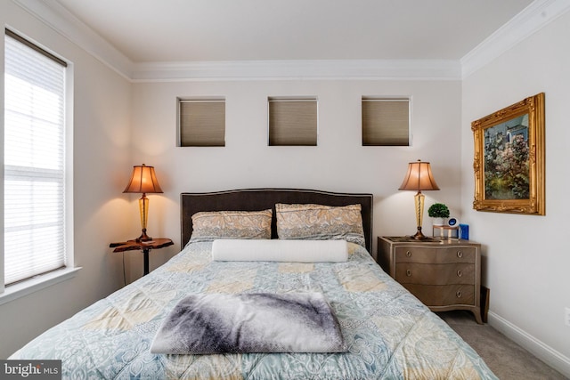 bedroom featuring carpet floors, baseboards, and crown molding