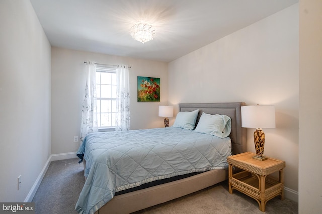 carpeted bedroom with baseboards