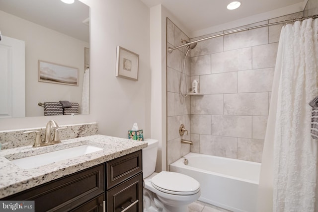 full bath featuring shower / bath combo, vanity, toilet, and tile patterned floors