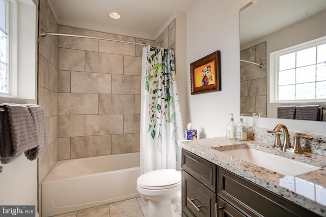 full bathroom with toilet, shower / bath combo, vanity, and tile patterned floors