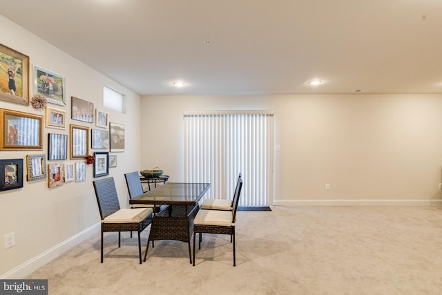 dining area with recessed lighting, light carpet, and baseboards