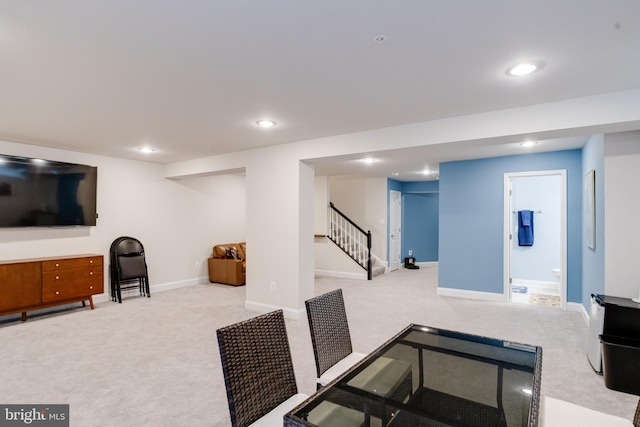 exercise area with carpet floors, baseboards, and recessed lighting