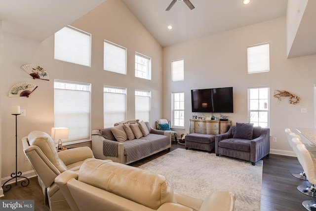 living room with dark wood finished floors, recessed lighting, ceiling fan, high vaulted ceiling, and baseboards