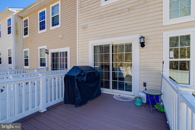 wooden deck with area for grilling