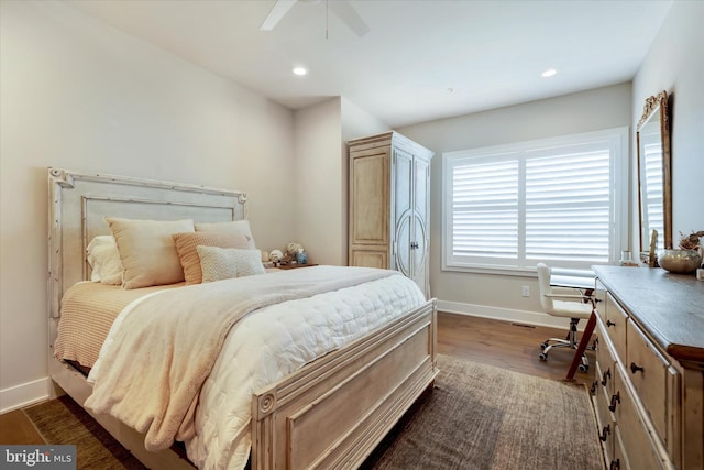 bedroom featuring a ceiling fan, recessed lighting, dark wood-style flooring, and baseboards