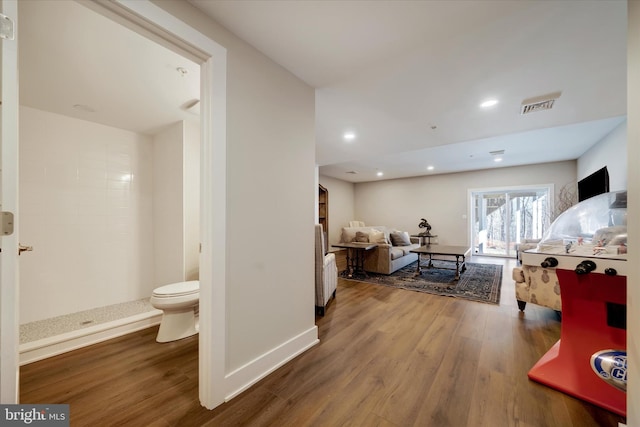 interior space with recessed lighting, visible vents, baseboards, and wood finished floors