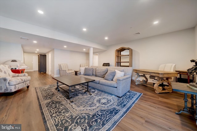 living area featuring wood finished floors, visible vents, and recessed lighting