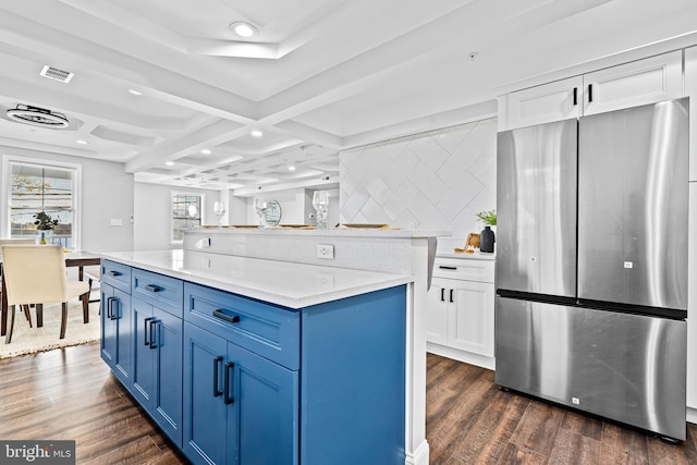 kitchen featuring dark wood-style floors, recessed lighting, freestanding refrigerator, and blue cabinets