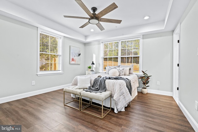 bedroom with a ceiling fan, baseboards, wood finished floors, and recessed lighting