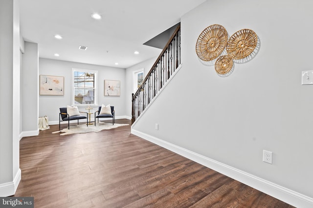 foyer entrance with recessed lighting, wood finished floors, visible vents, baseboards, and stairway