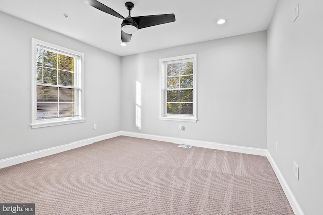 empty room featuring visible vents, baseboards, a ceiling fan, carpet flooring, and recessed lighting