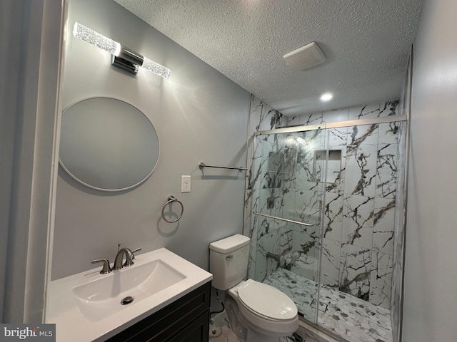 full bath featuring a textured ceiling, toilet, vanity, visible vents, and a marble finish shower