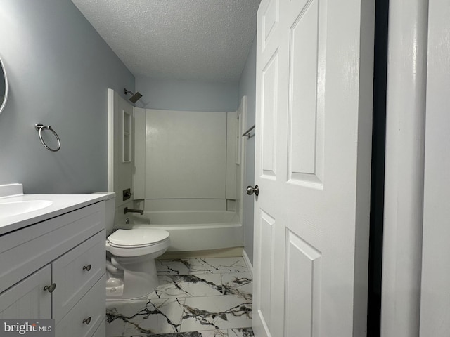 full bath featuring toilet, marble finish floor, a textured ceiling, vanity, and shower / bathing tub combination