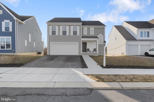 view of front of property featuring a garage and driveway