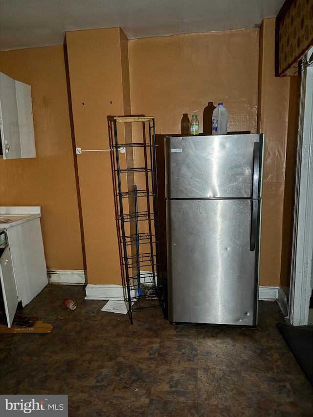 kitchen with freestanding refrigerator