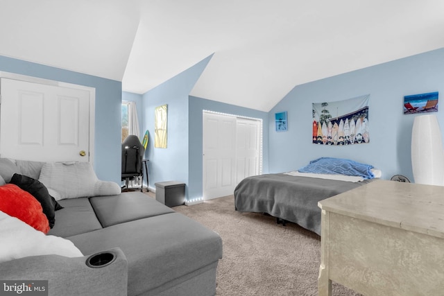 bedroom featuring a closet, carpet flooring, and vaulted ceiling