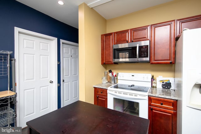 kitchen with reddish brown cabinets, white appliances, and light stone counters