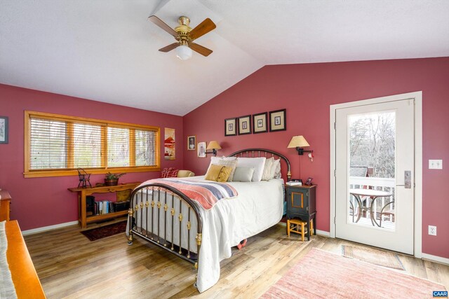 bedroom with lofted ceiling, ceiling fan, baseboards, and wood finished floors