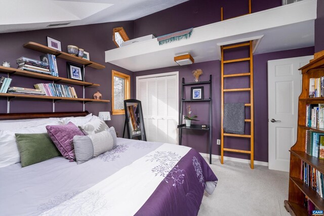 bedroom featuring lofted ceiling, light carpet, and baseboards