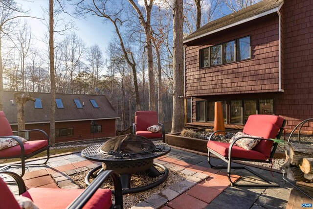 view of patio with a fire pit