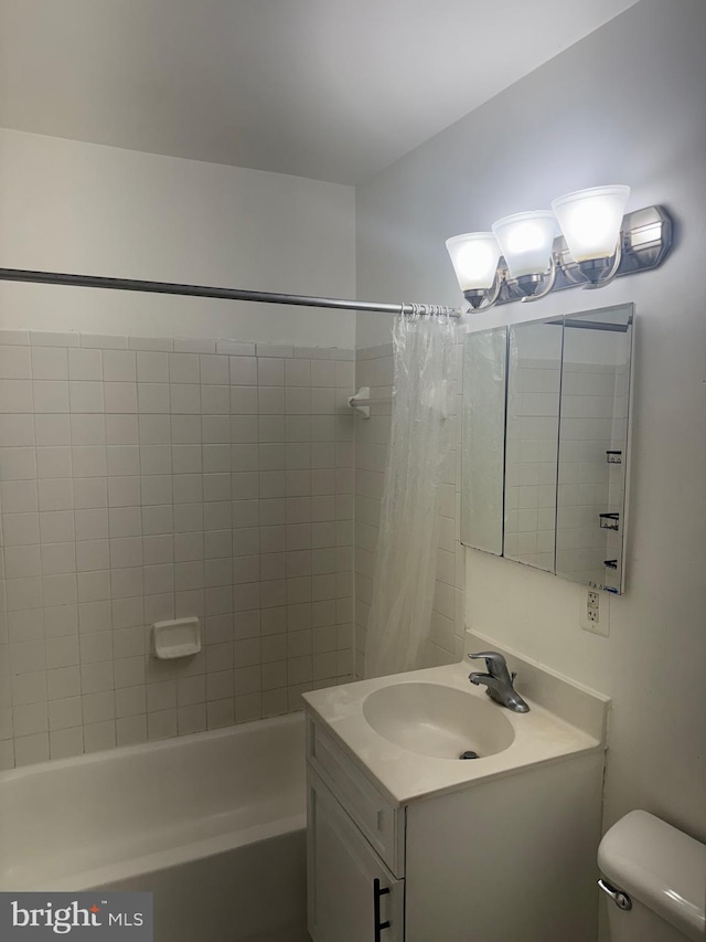 full bath with vanity, toilet, and shower / tub combo with curtain