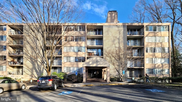 view of property with uncovered parking