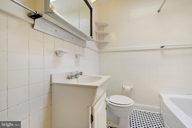 full bath featuring a tub to relax in, toilet, vanity, tile walls, and a shower