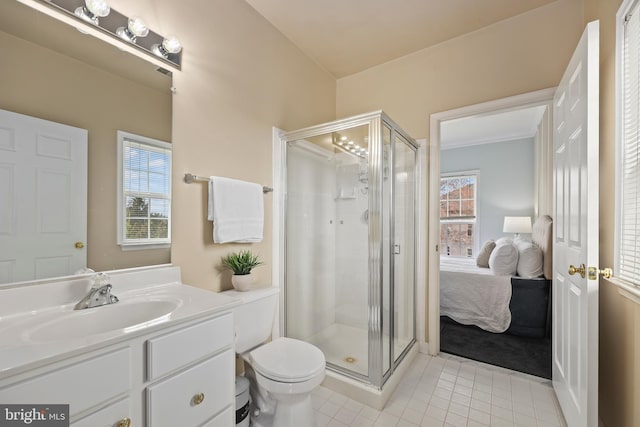 ensuite bathroom featuring a stall shower, vanity, toilet, and ensuite bathroom