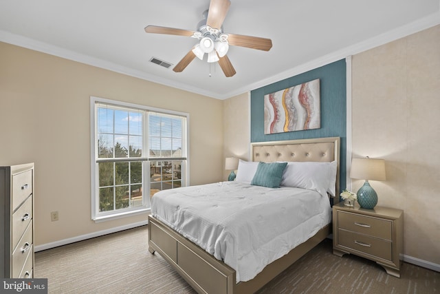 bedroom featuring ornamental molding, carpet flooring, visible vents, and baseboards