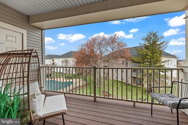 wooden terrace with a residential view