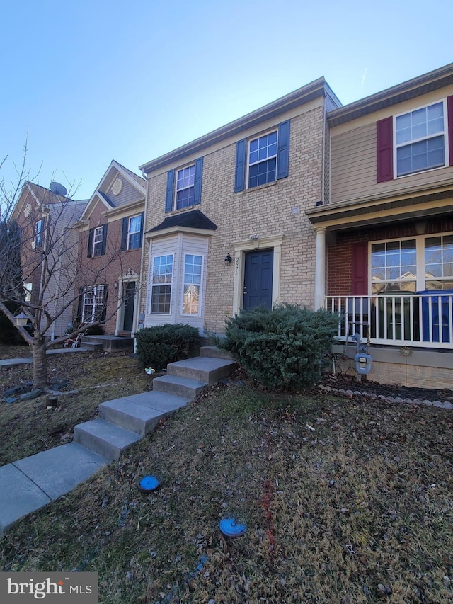 view of front facade featuring brick siding