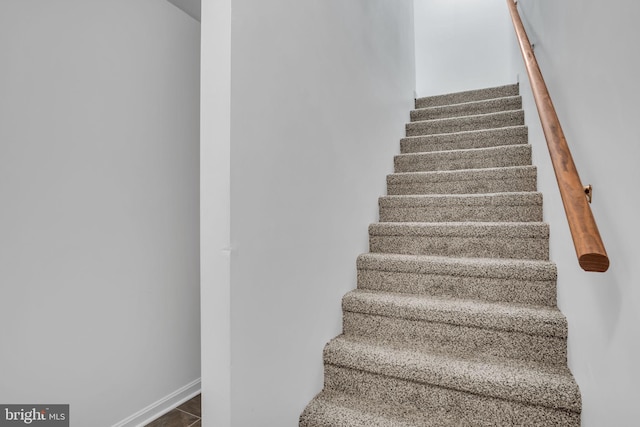 stairs featuring baseboards